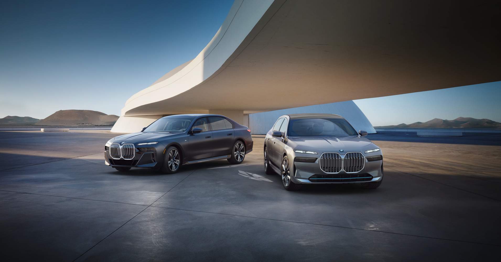 The 2023 BMW 7 Series and the 2023 BMW i7 parked under bridge